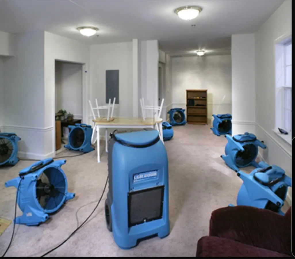 Air movers and dehumidifier setup for Water Damage Restoration in Briar